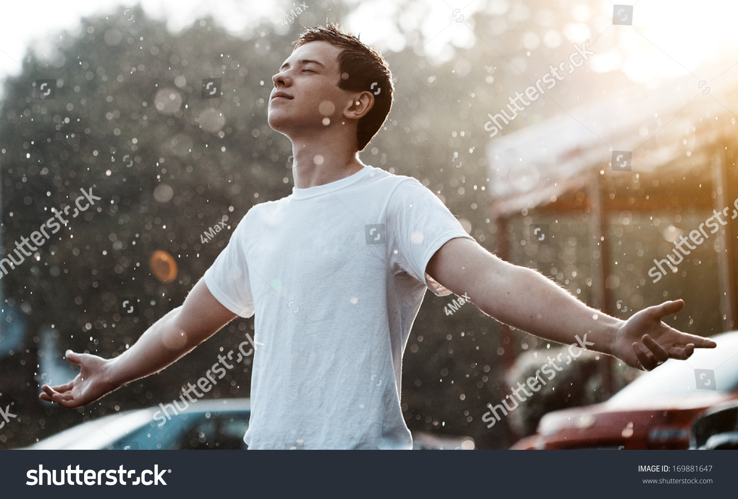 teenage boy under rain in the city