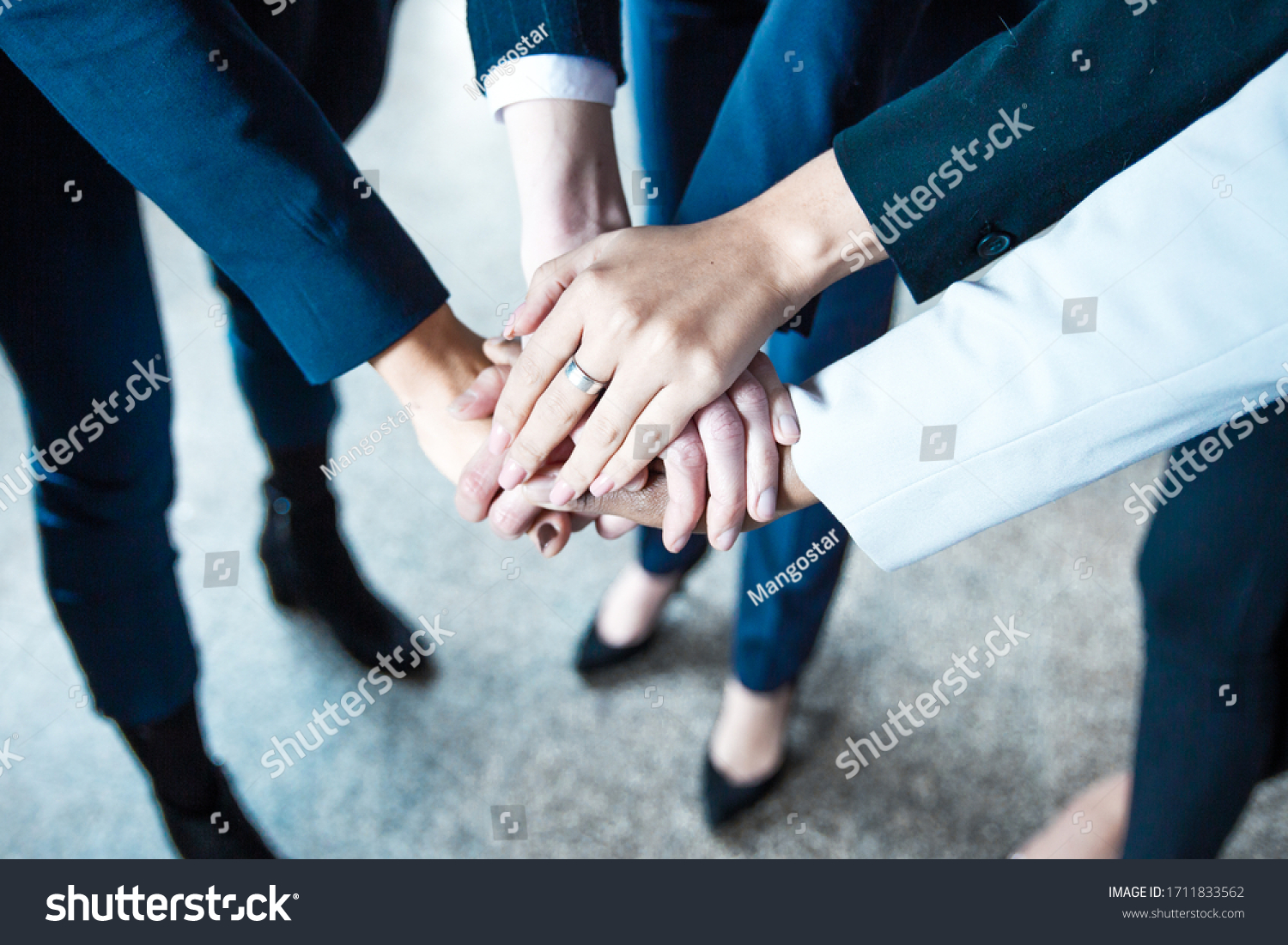 Cropped shot of women putting hands together in circle. Closeup shot of female hands. Teamwork concept