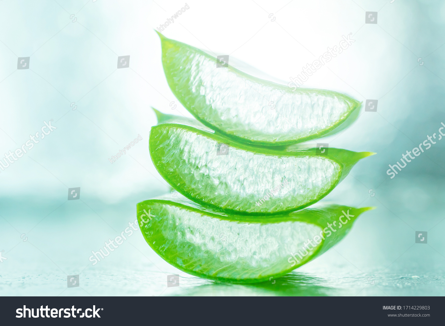 Aloe vera gel in a green leaf close-up on a light background. Skincare healthcare concept. Aloe fresh juice macro shot. Alternative medicine moisturizing cosmetics.
