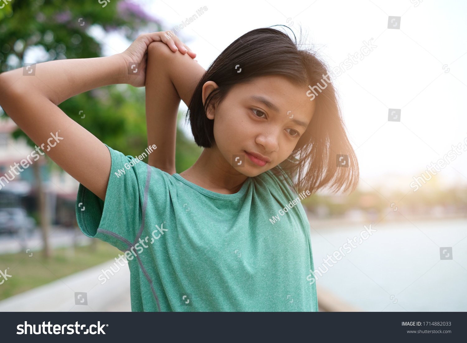 Young Asian girl exercise at health park.