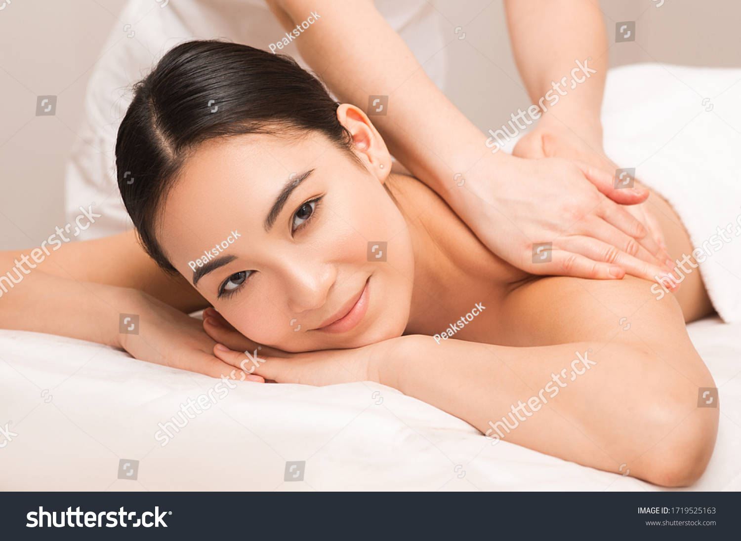 Thai Massage therapy. Portrait asian woman enjoying massage at the spa.