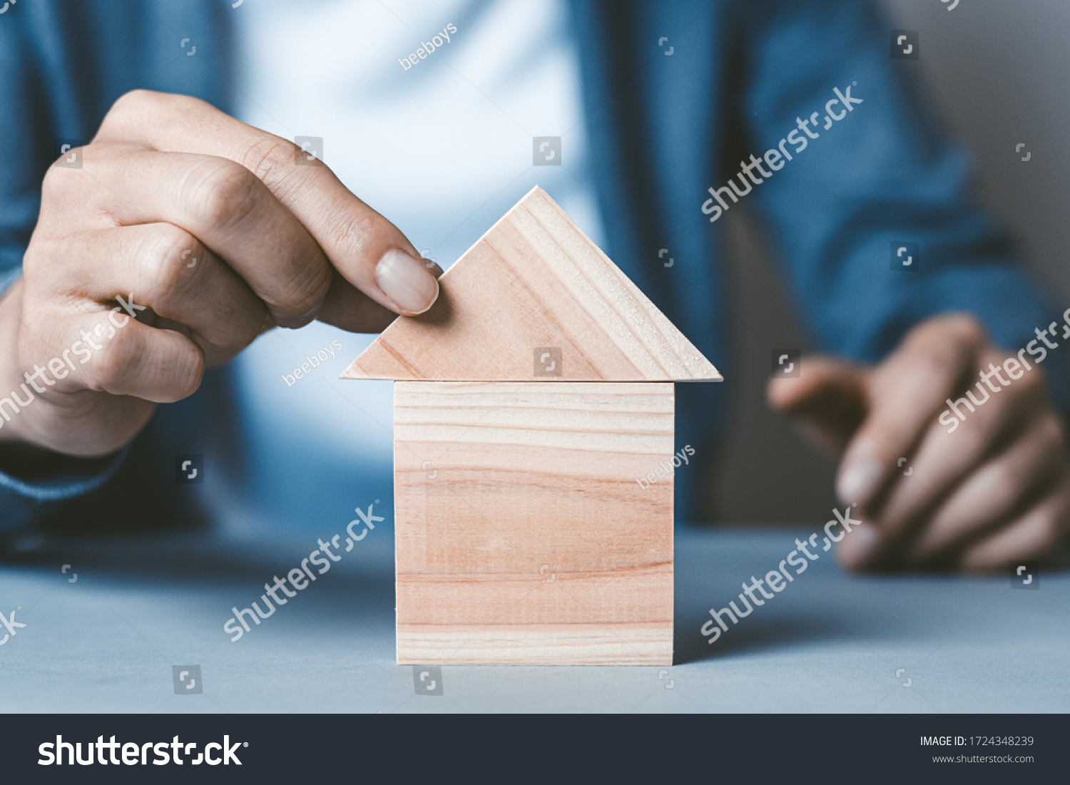 Man assembling a building house