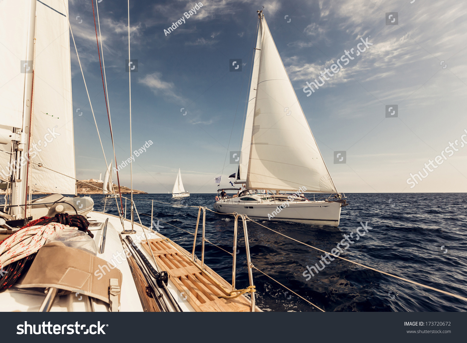 Sailing ship yachts with white sails in the open sea