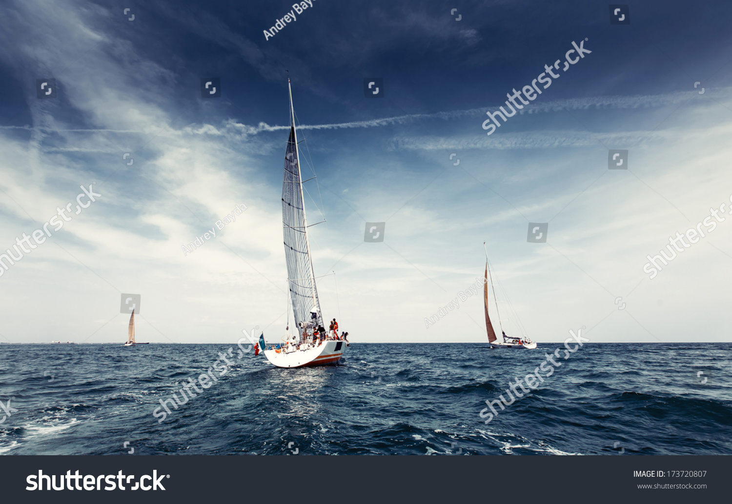 Sailing ship yachts with white sails in the open sea