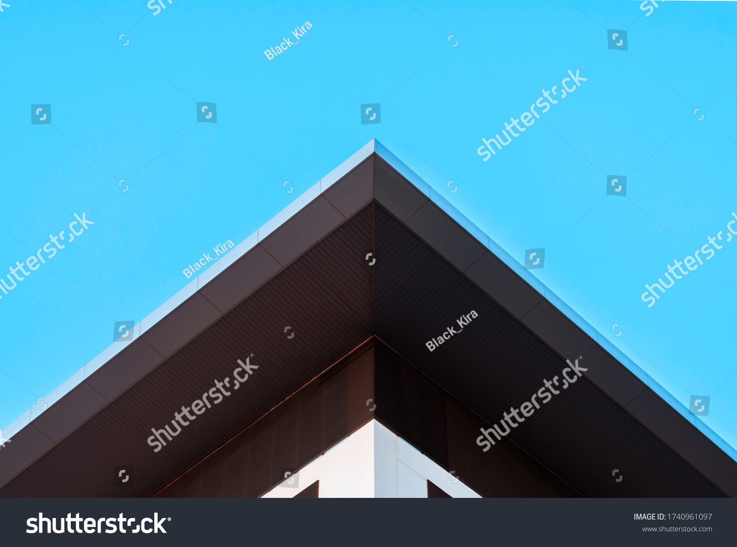 Abstract symmetry geometry triangular high building on blue sky