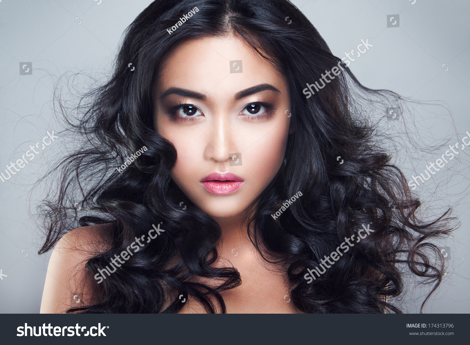 Young and beautiful asian woman with curly hair