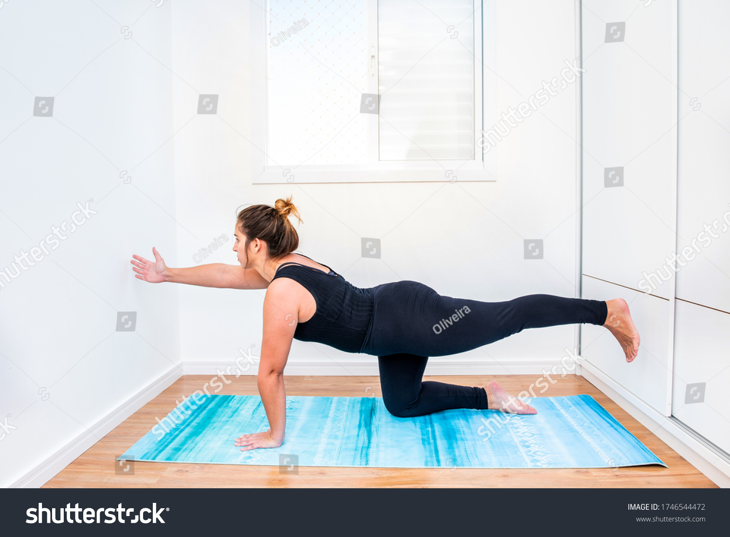 practicing yoga at home utthita marjaryasana posture