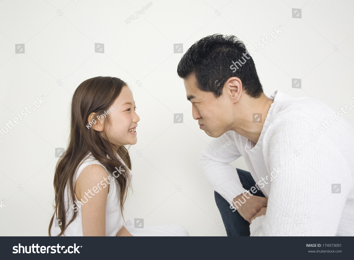 Japanese Father and daughter staring each other