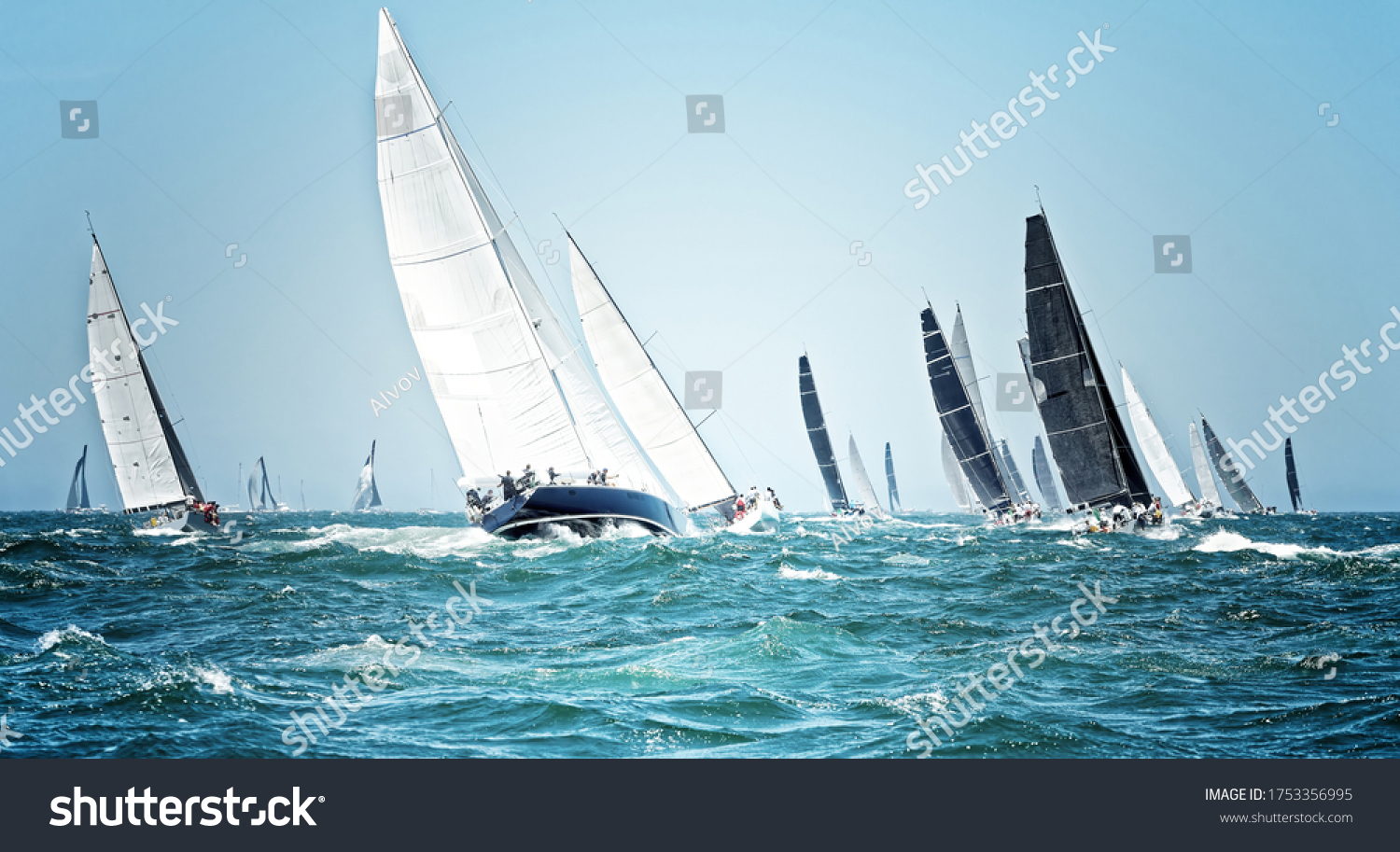 Sailing ships race. Beautiful sailboats under sail on a cruise regatta. Travel and tourism at sea