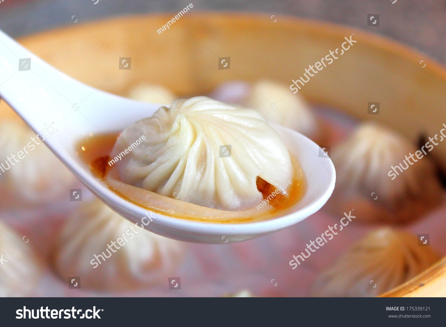 Xiao Long Bao  steamed pork dumplings with soup inside served in bamboo steamer