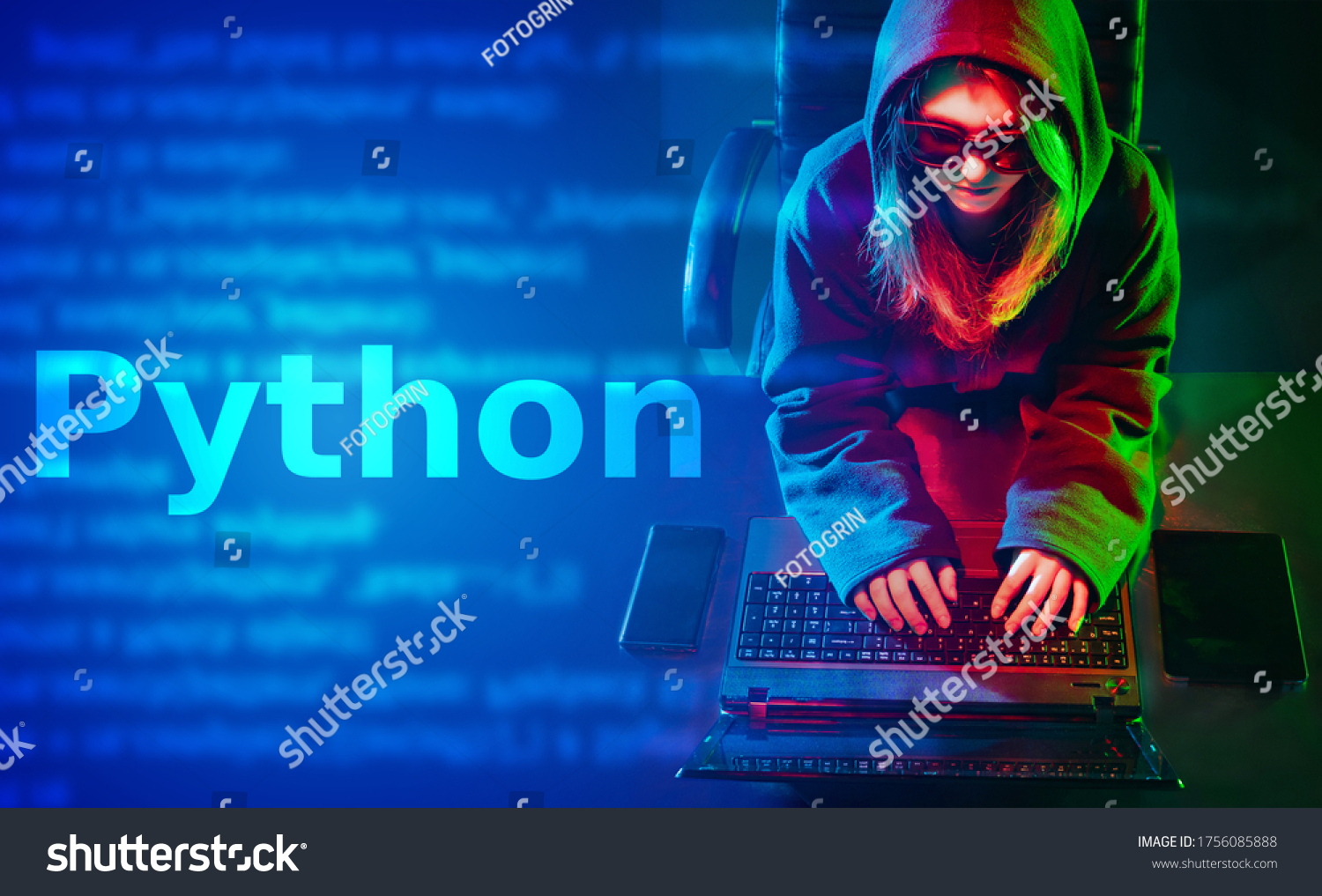 Python programming language. A long-haired girl in a hoodie writes a program in Python. Concept of programming languages. A woman develops software on Python.
