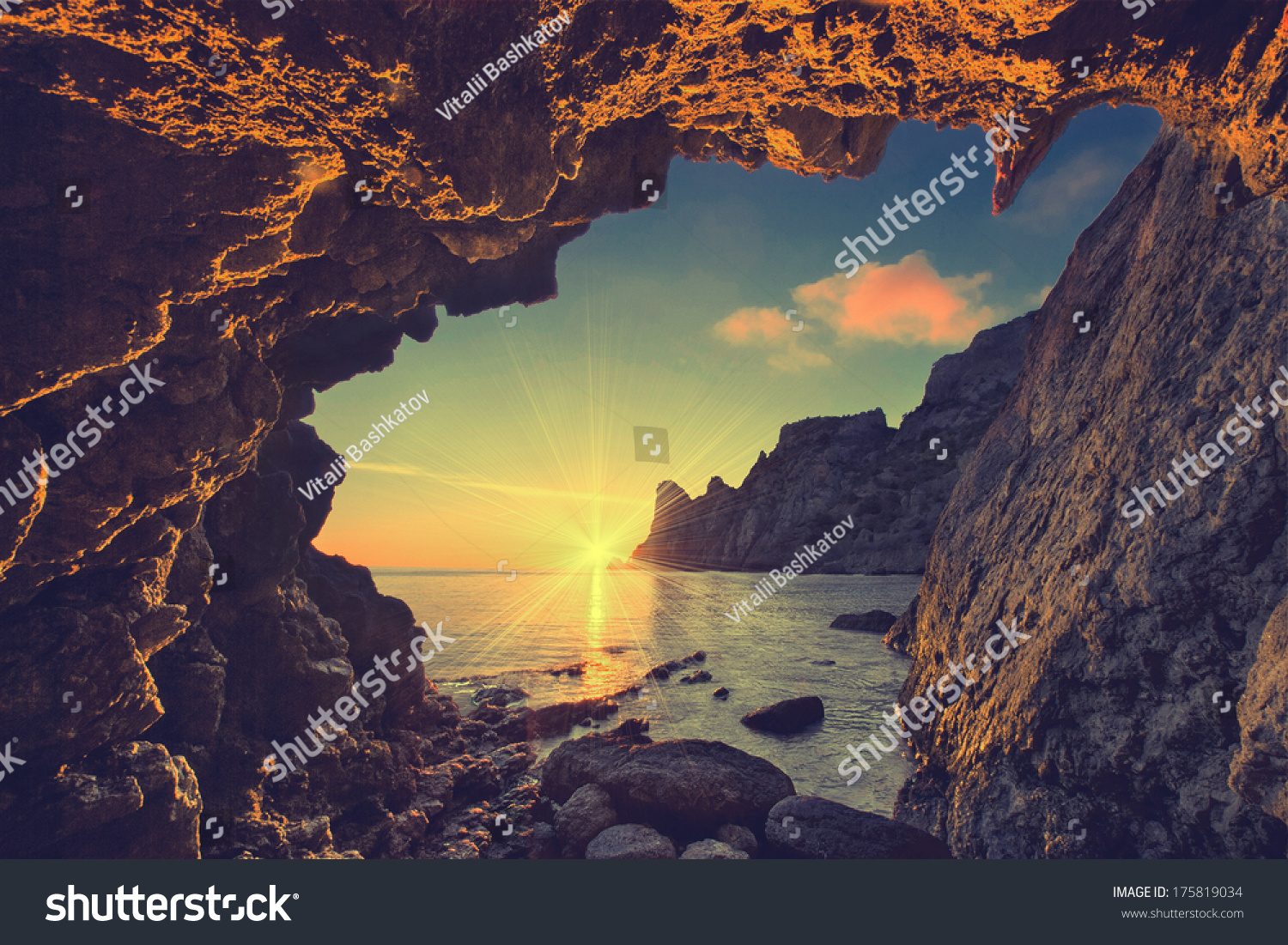 Vintage sea sunset from the mountain cave
