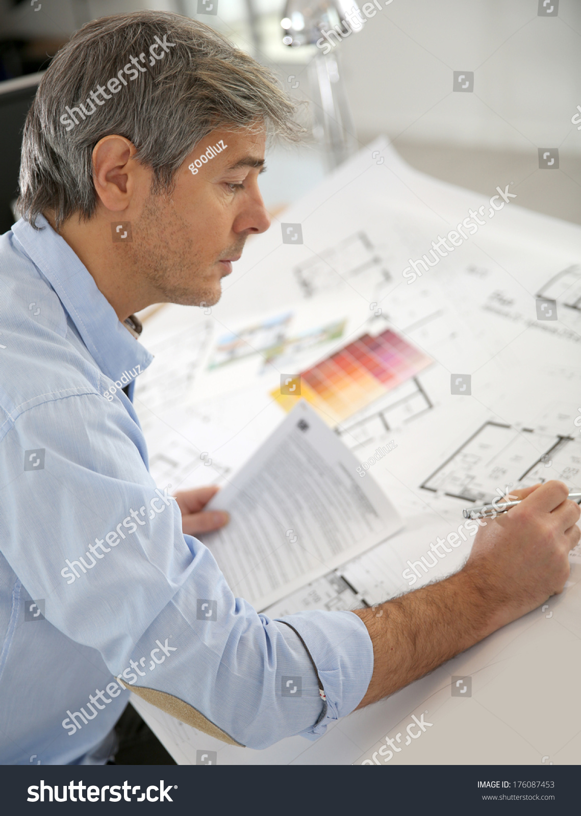 Architect working on construction project in office