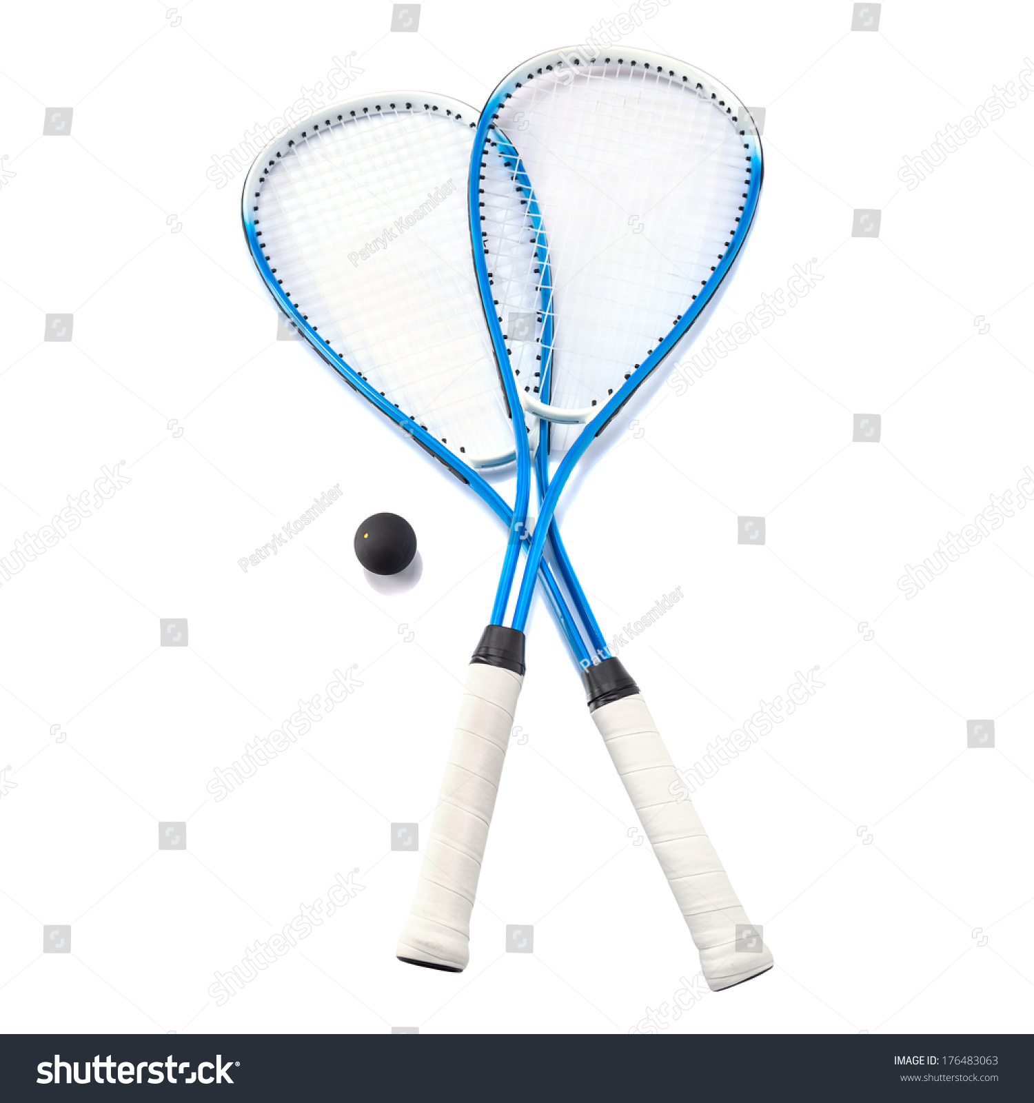 Squash rackets and ball over white