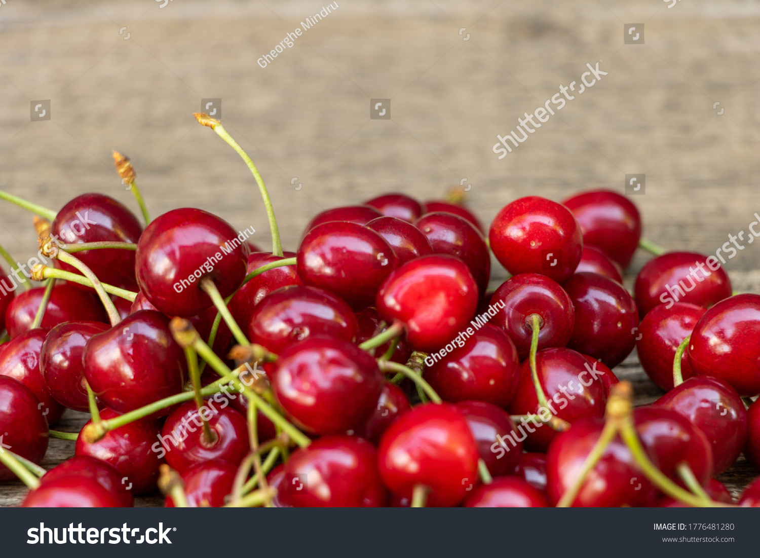 Tasty cherries on wooden background  the benefits of cherries