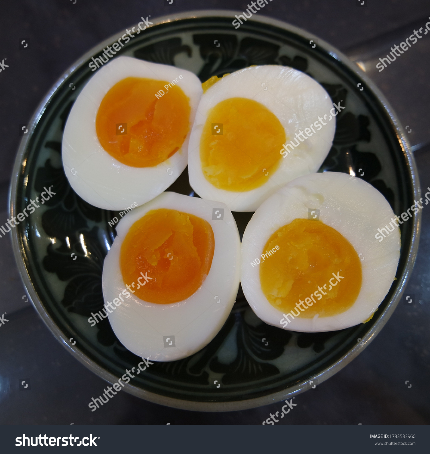 fourhalfboiledeggsonaplate