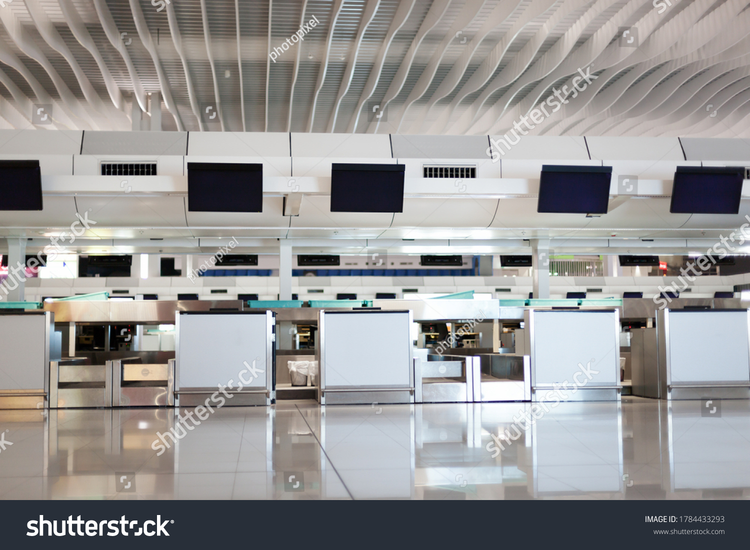 Check-in counter with monitors in interior hall of airport. Nobody_站酷海洛 ...