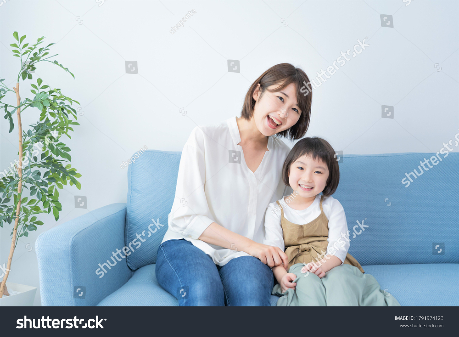 Asian mom and daughter spending time indoors