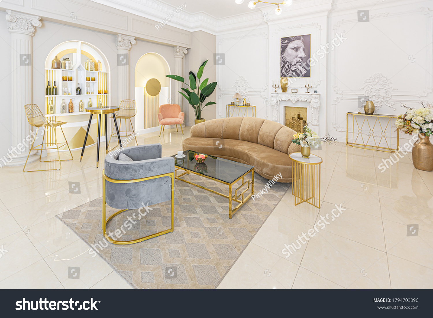chic luxury interior in an old antique style open-plan apartment decorated with columns and stucco on the wall in pastel colors. tiles on the floor. beige walls