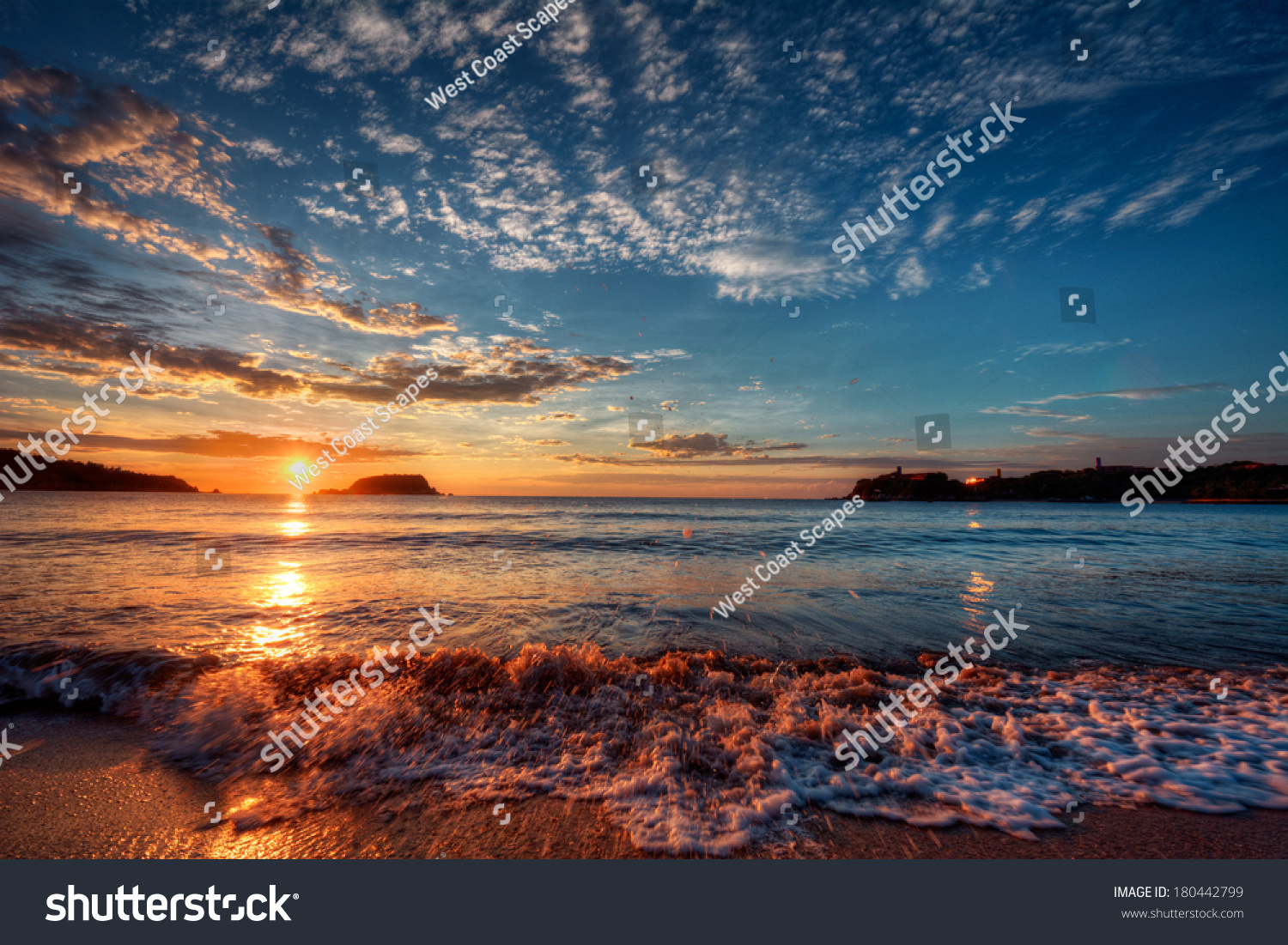 Majestic ocean sunset with a breaking wave