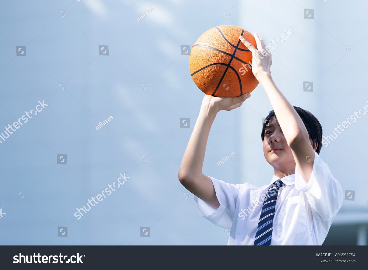 Junior high school student playing basketball