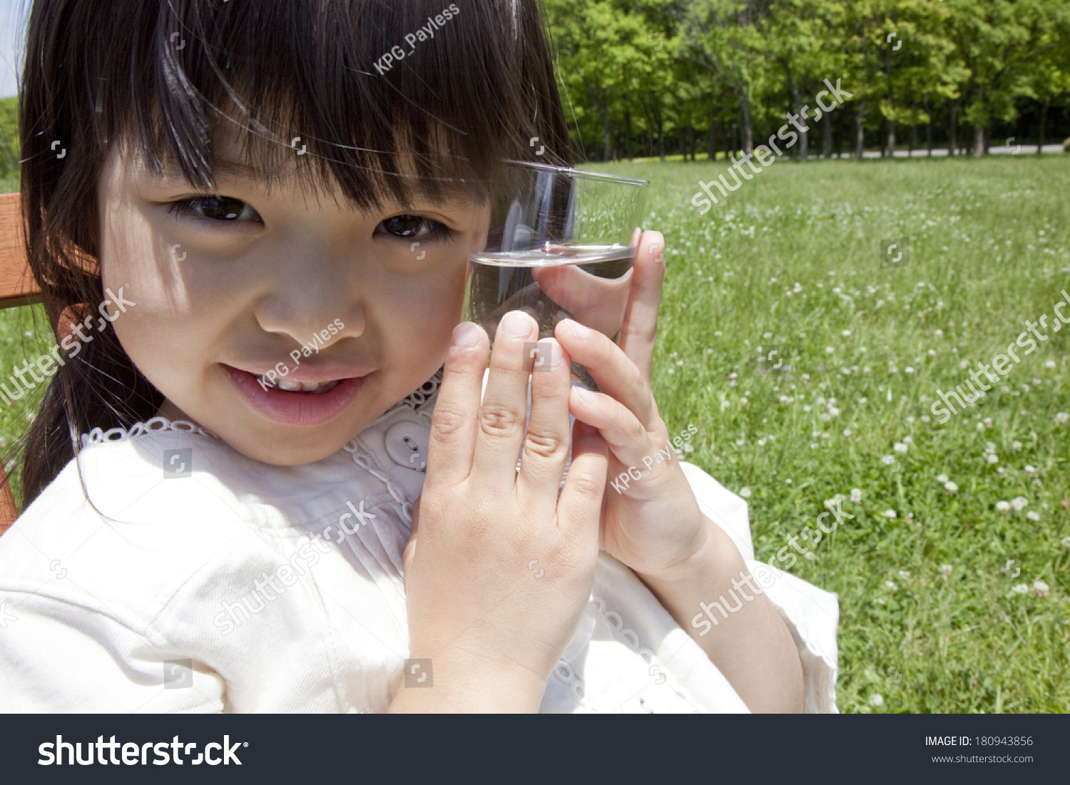 Japanese Girl's cheek in contact with a cup