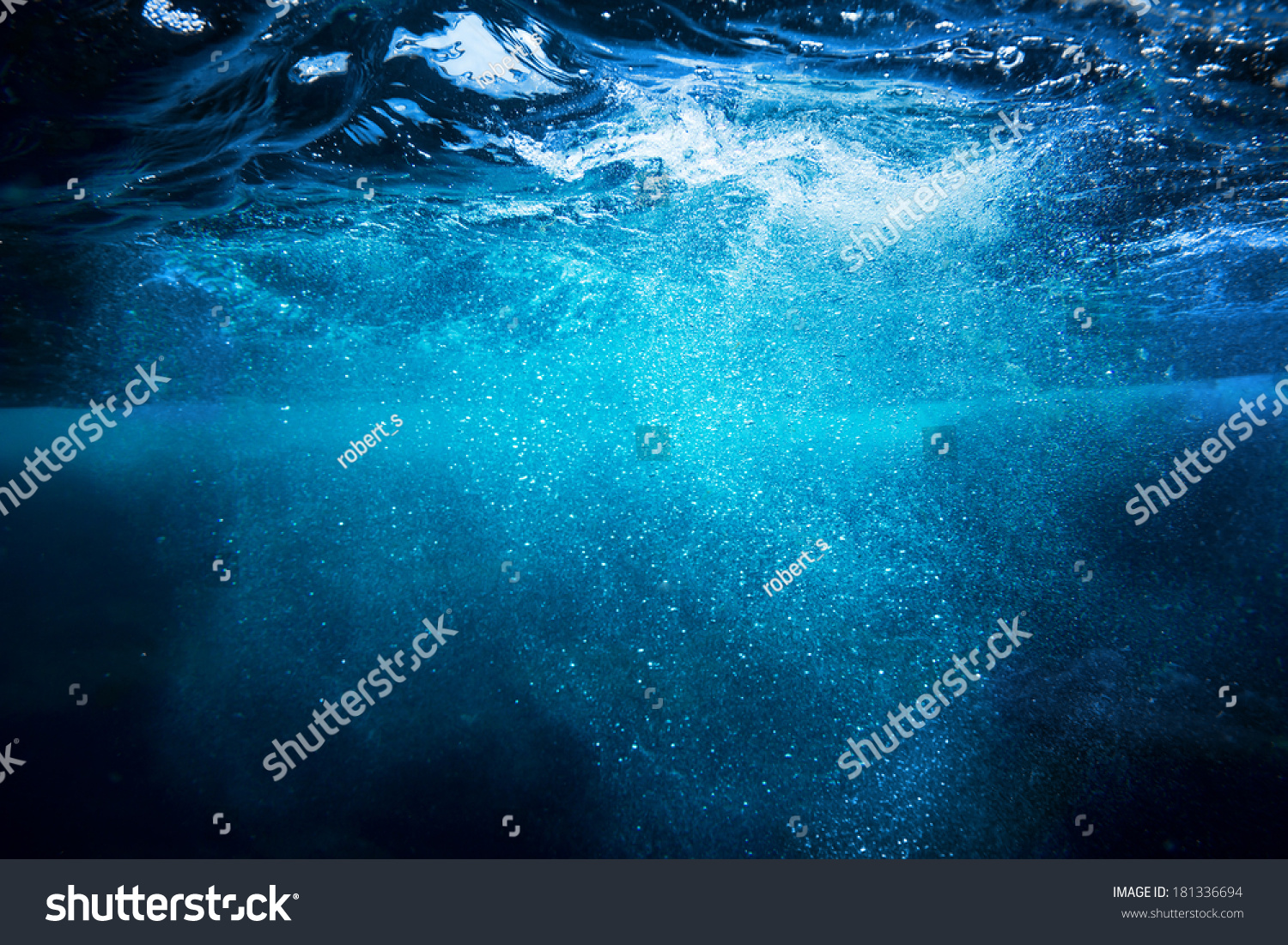 Sea bottom with blue water wave splash background