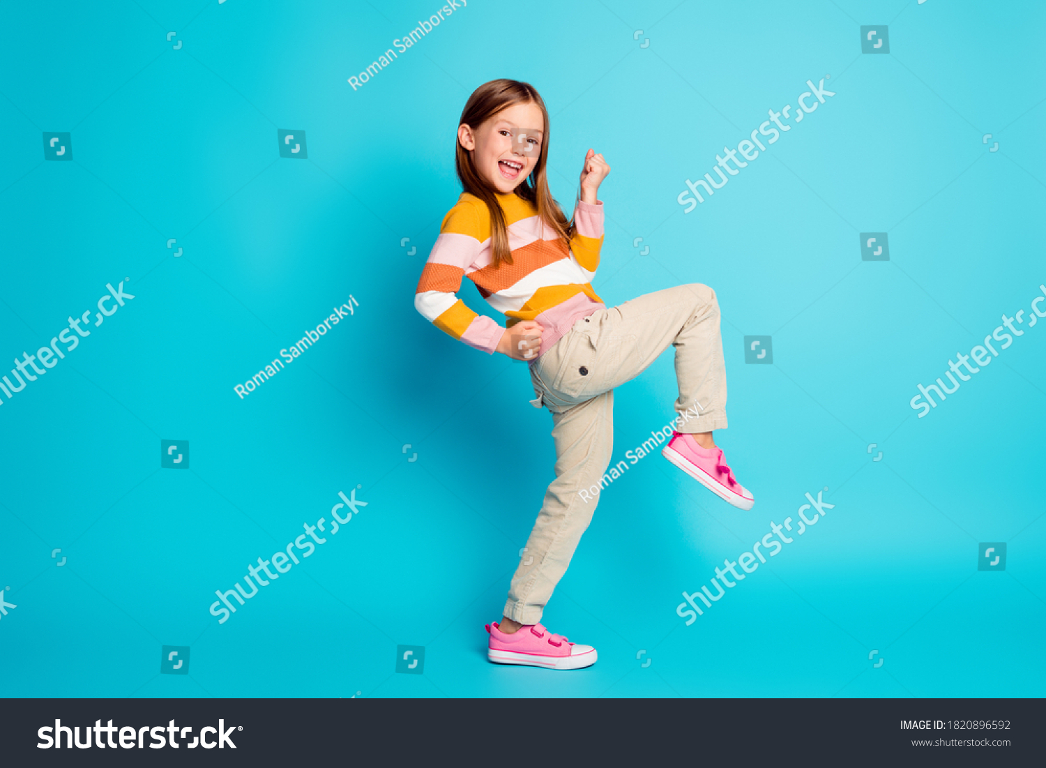 Full length body size profile side view of her she nice attractive pretty lucky glad cheerful cheery girl celebrating great success isolated over bright vivid shine vibrant blue color background