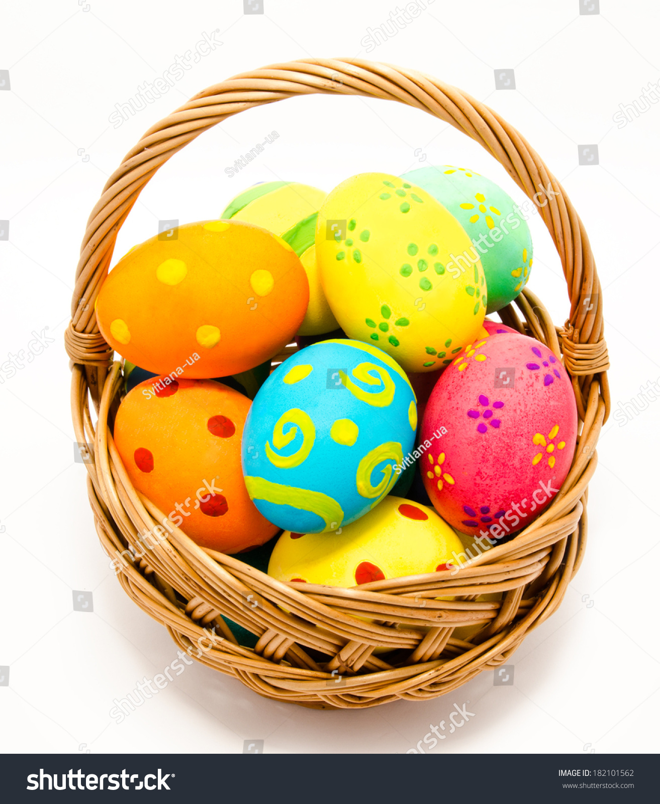 colorfulhandmadeeastereggsinthebasketisolatedonawhitebackground