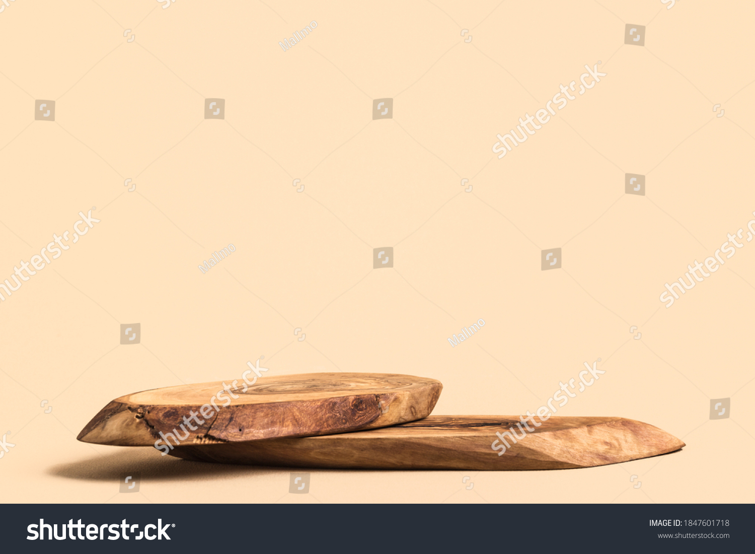 Wood podium on beige background for cosmetic product mockup.