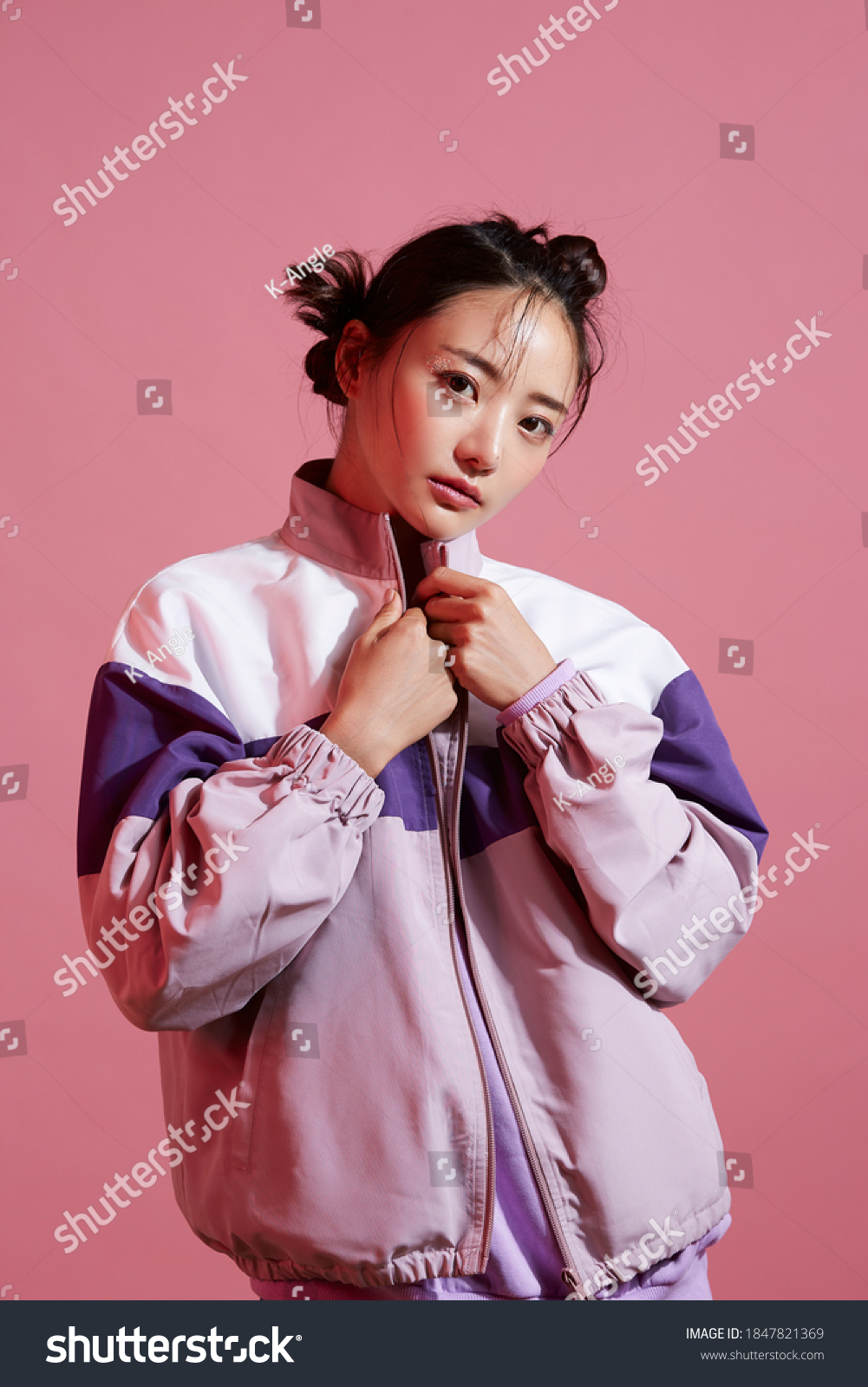 Young Asian woman with glitter make-up wearing sporty fashion