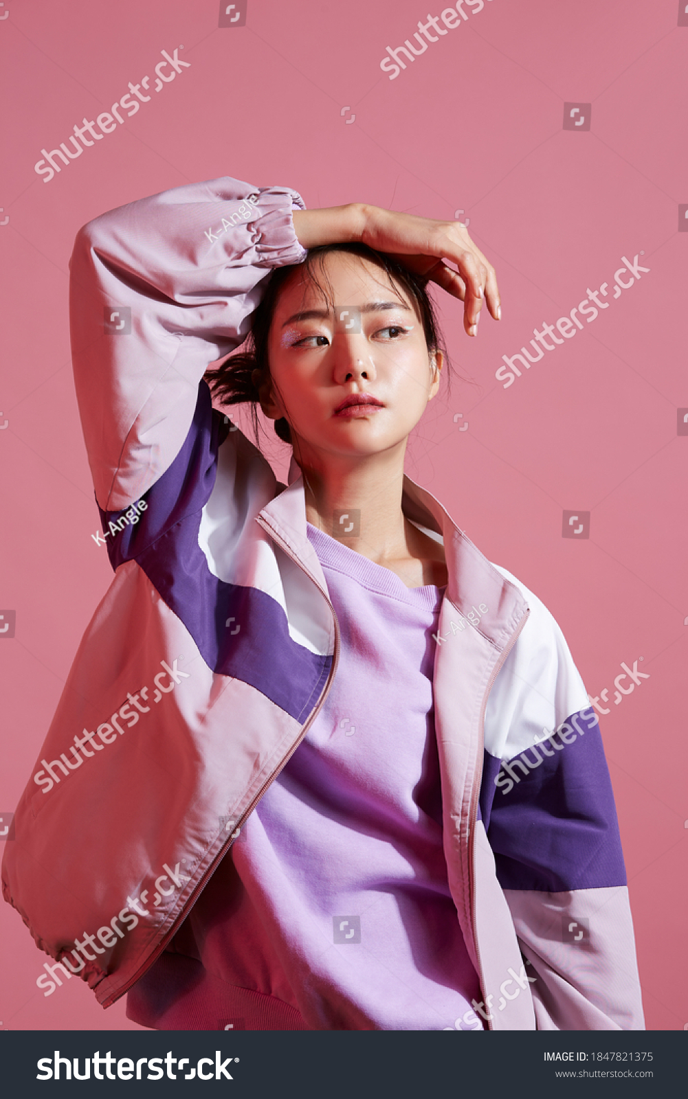 Young Asian woman with glitter make-up wearing sporty fashion