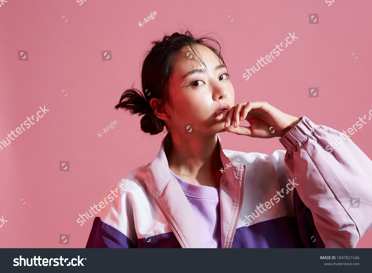 Young Asian woman with glitter make-up wearing sporty fashion