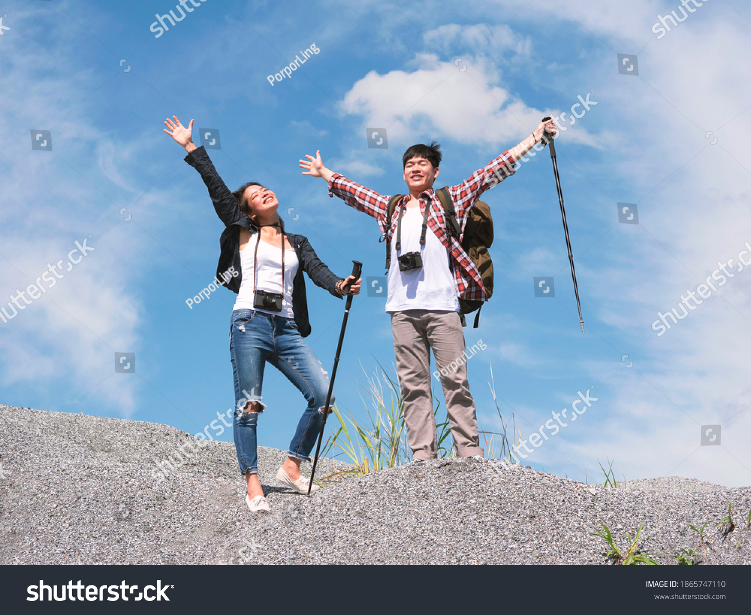 Portrait Asian young men and women relax breath of natural fresh air. Enjoy your trip hiking trekking pole travel.