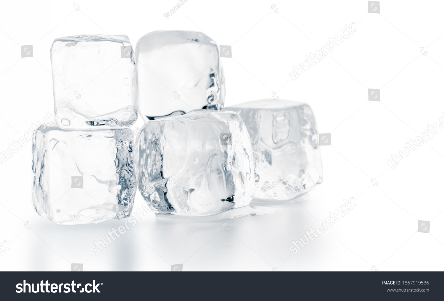 Natural ice cubes on white surface. Purity and refreshment concept.