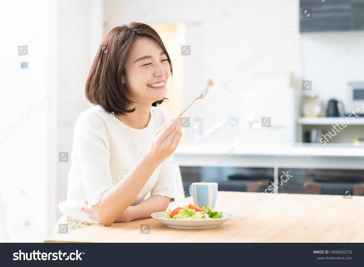 young attractive asian woman who eats