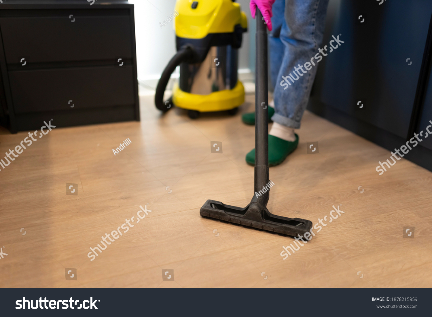 the parquet floor in the room with professional vacuum cleaner