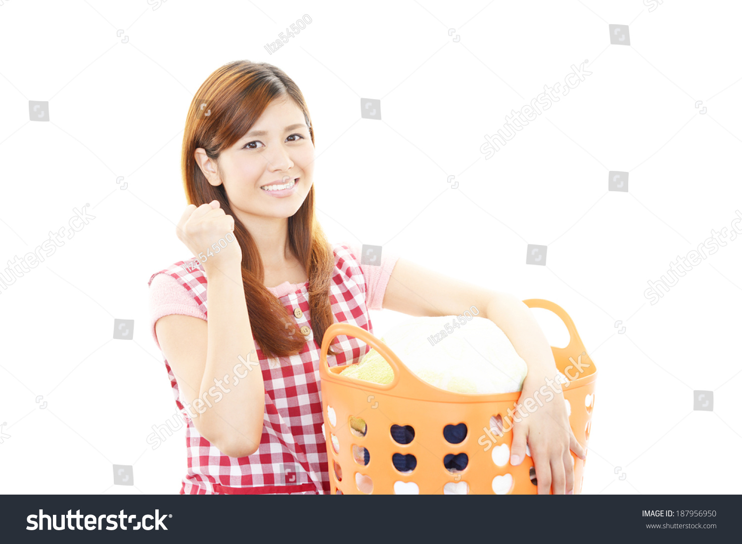 The woman is holding a laundry basket