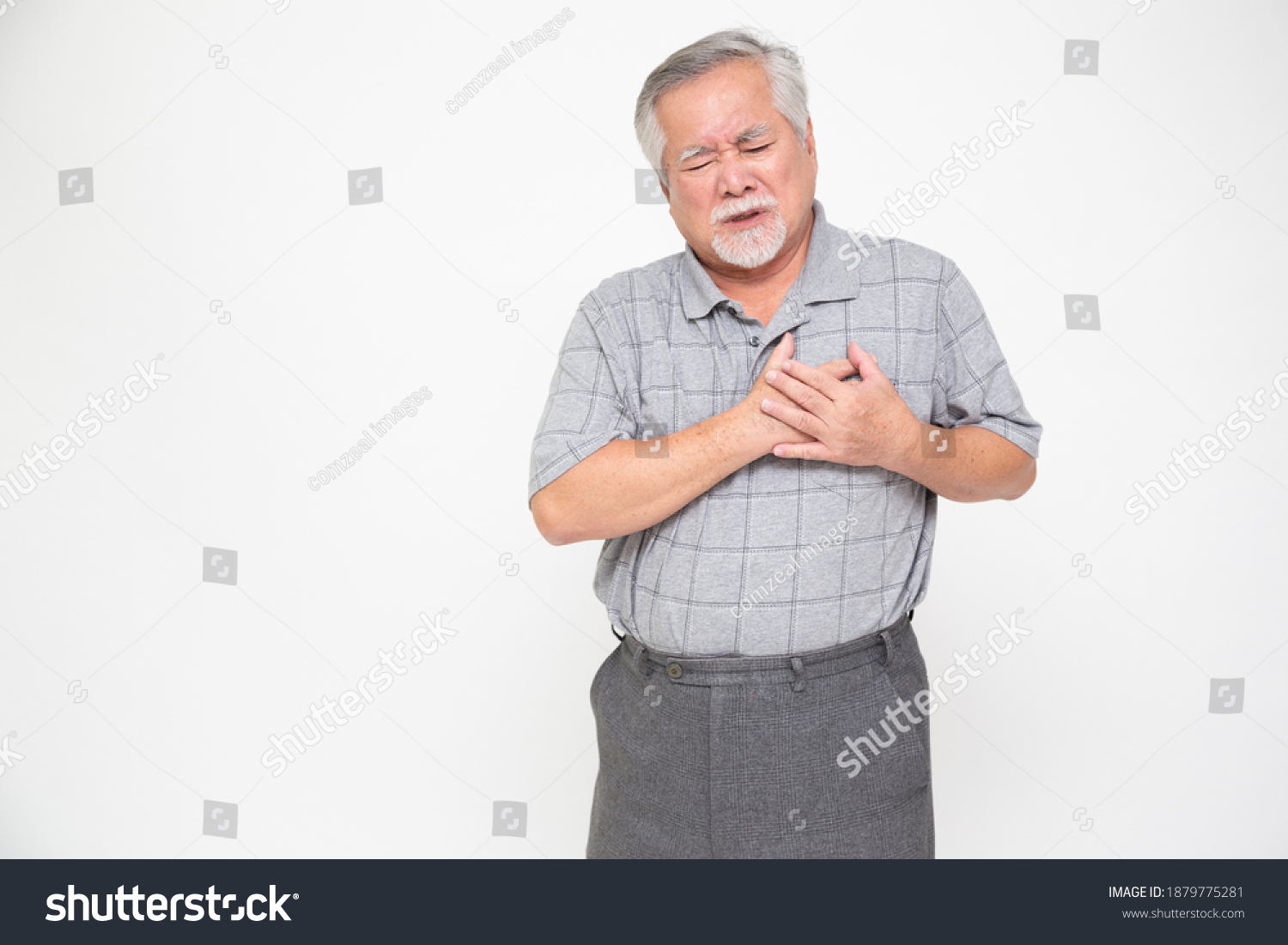 Asian senior man with pain on heart isolated on white background Health problem and feeling sick concept
