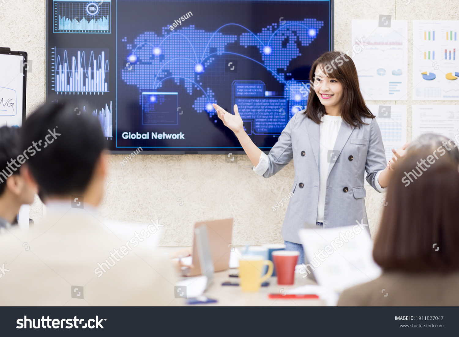 corporate teamwork - young asian busineswoman lead group of business startup team in strategic meeting presentation