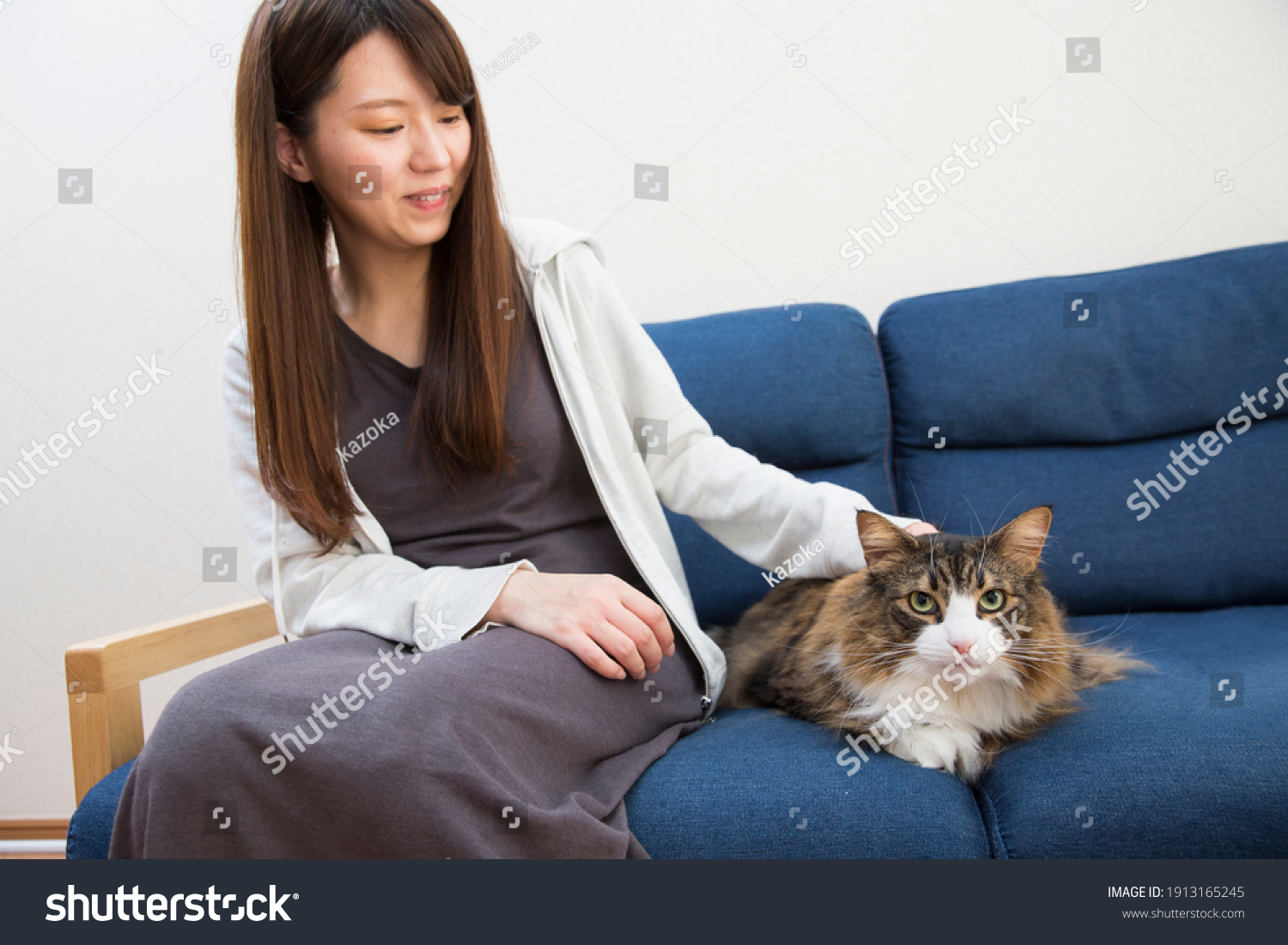 Japanese woman spending living room with pet cat