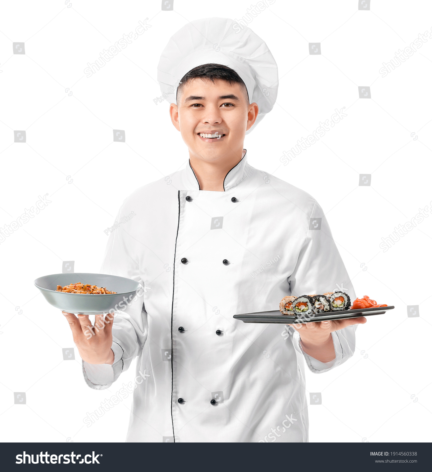 Handsome Asian chef with sushi rolls on white background