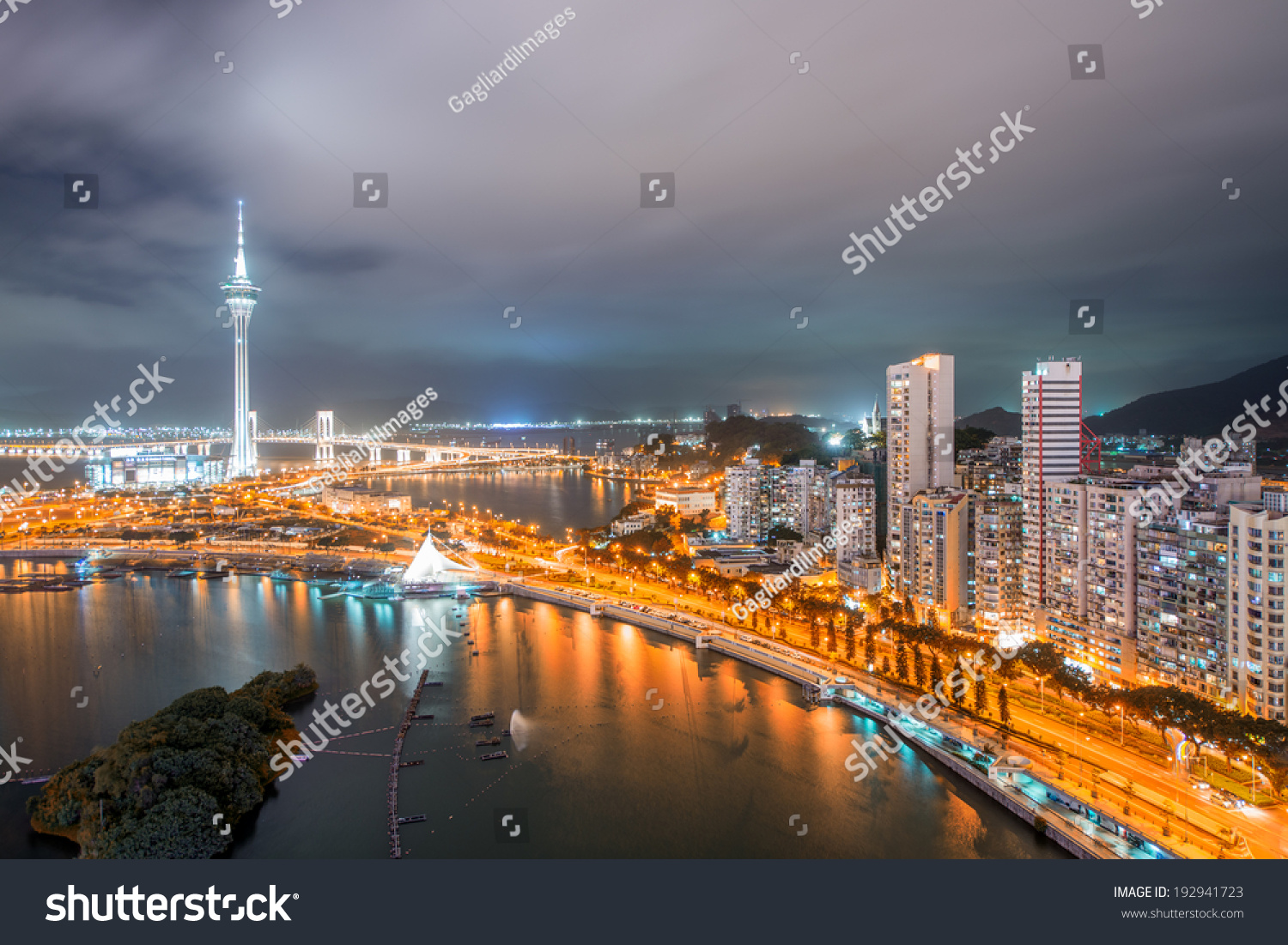 Macau  China. Aerial view of city buildings and tower at night.