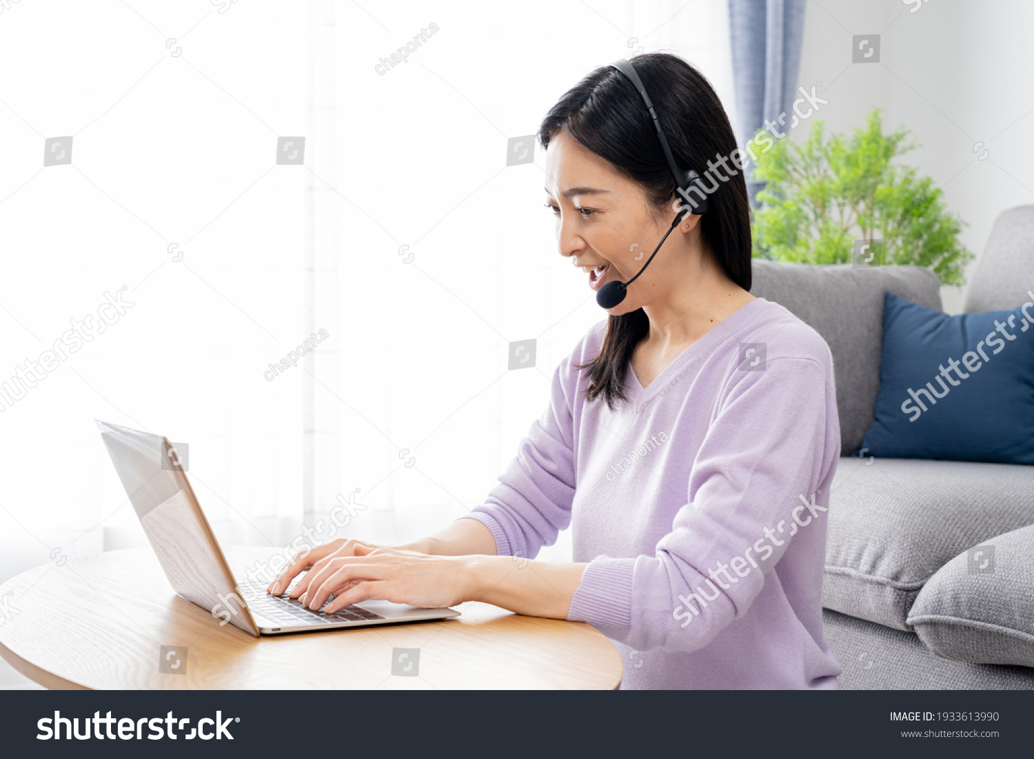 Asian woman talking at home