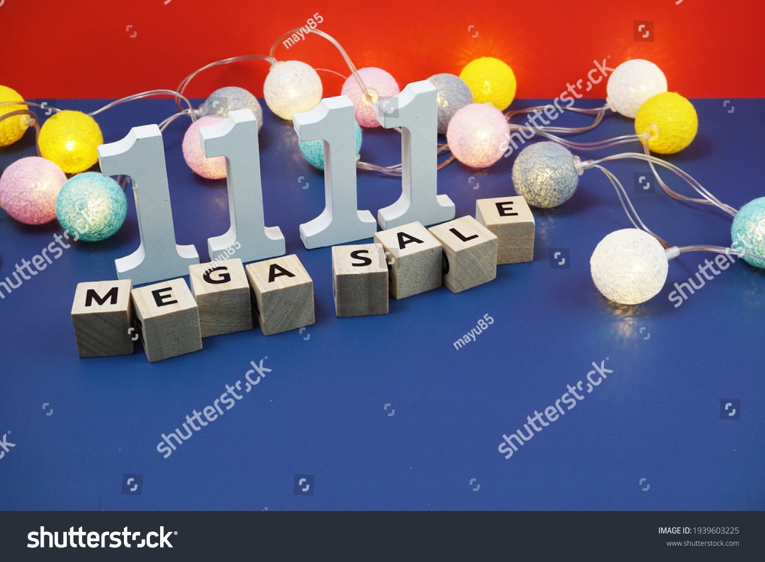 11.11 Mega Sale alphabet letter with LED cotton balls on blue  background