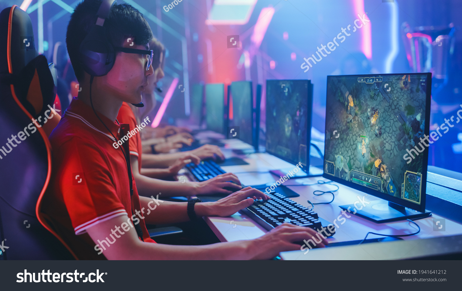 Pro Girl Plays Computer Game Plays RPG Strategy on a Championship. Diverse Esport Team of Pro Gamers Play in Mock-up Video Game. Stylish Neon Cyber Games Arena. Side View