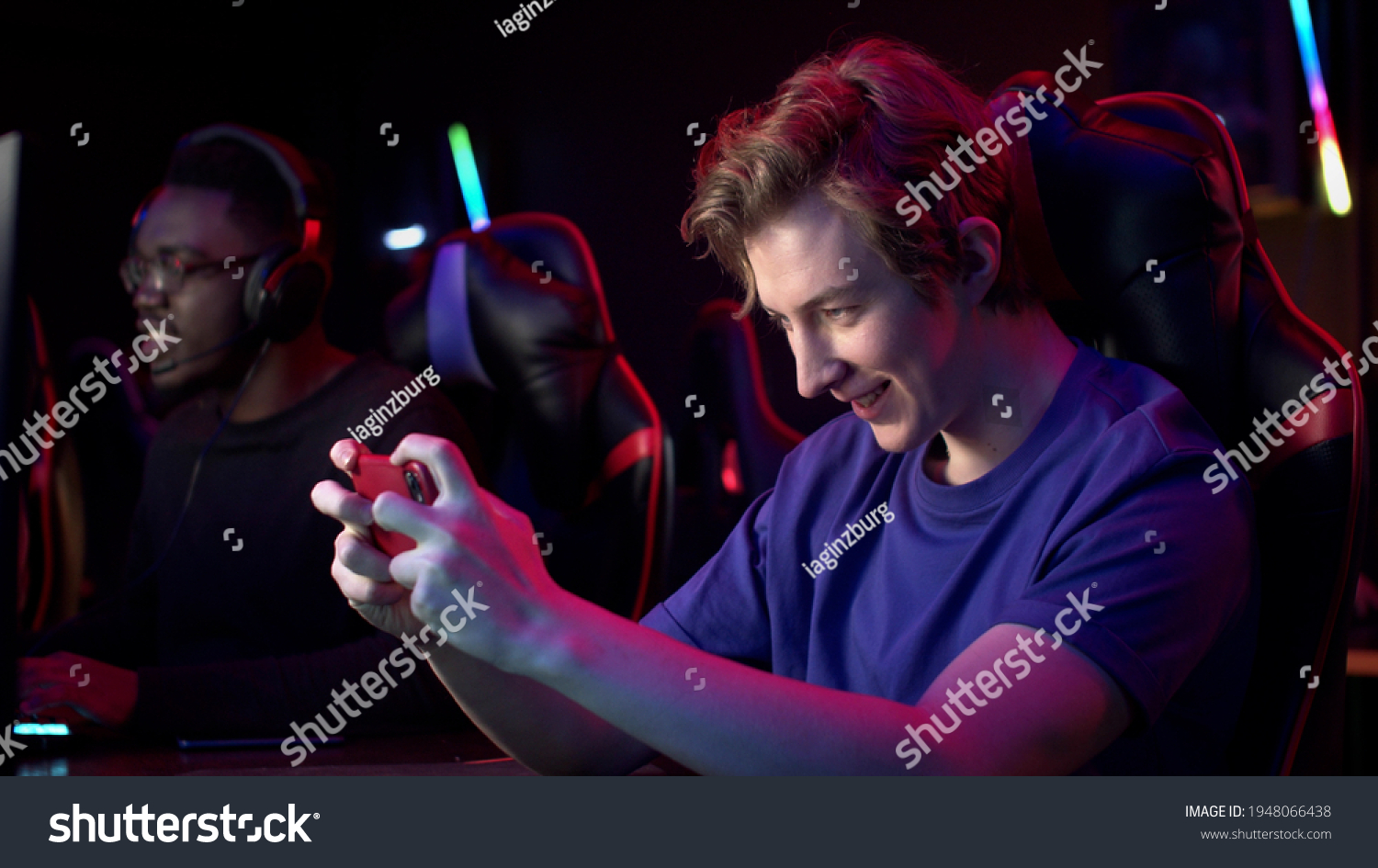 A gamer during a training session decided to relax and play a game on a smartphone  he wins and happily exhales