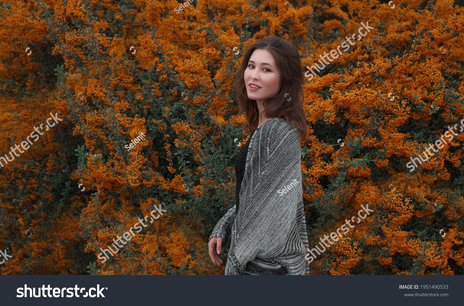 Close up portrait of a young asian woman outdoor. Autumn warm concept.