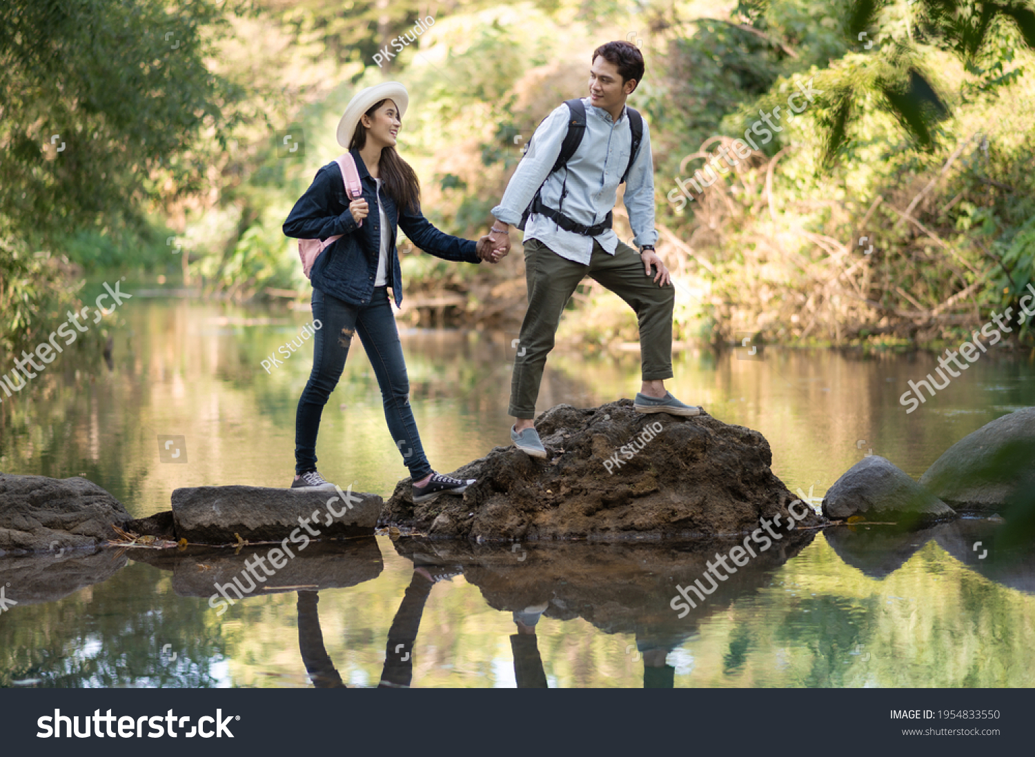 Asian couple traveling in the forest 