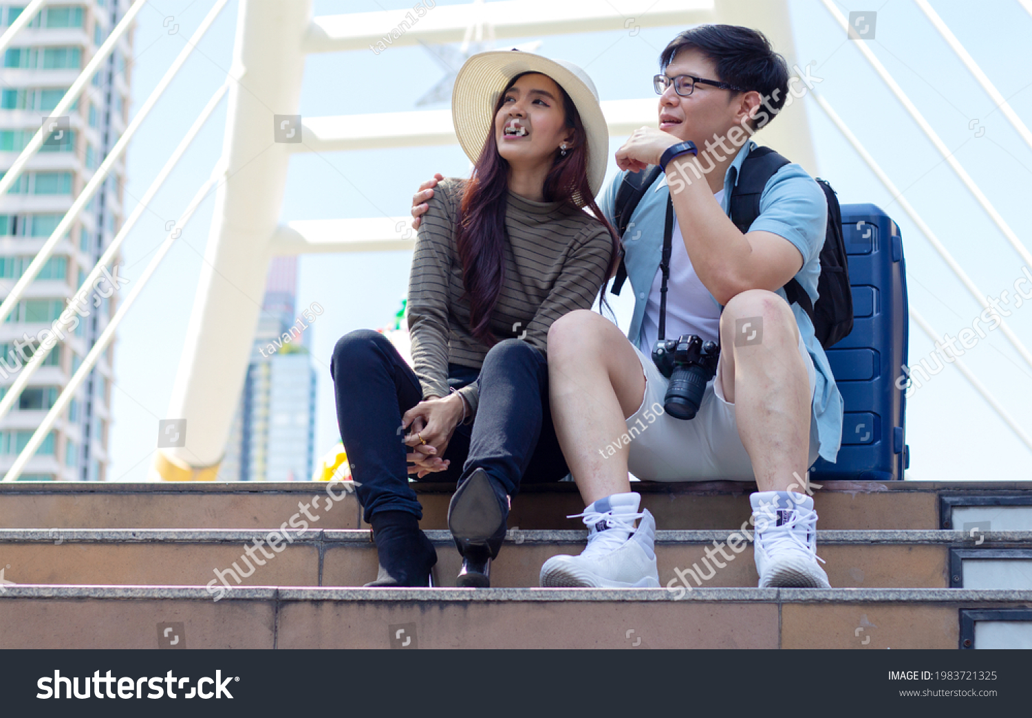 couple asian tourists and traveling in the city happily